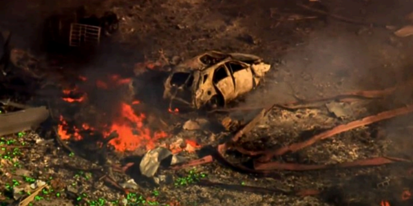 Car with flames after explosion